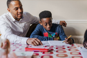 Dad helping son with homework