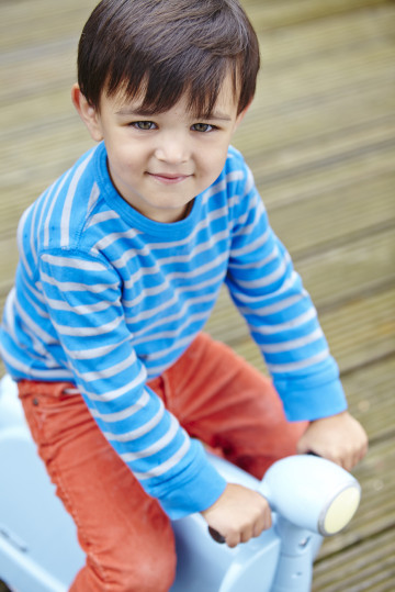 Boy playing on a scooter