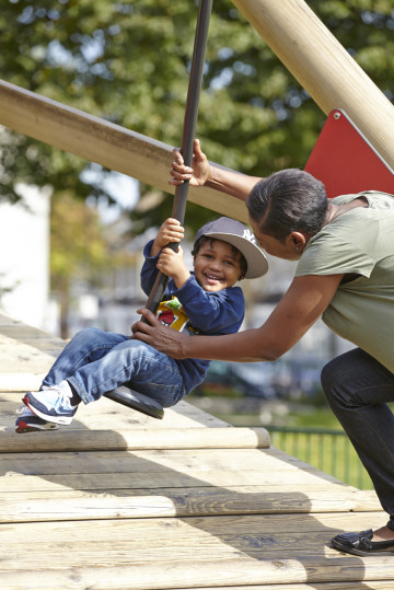 Mum and boy playing in park