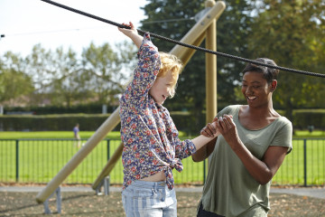 Mum and girl in park