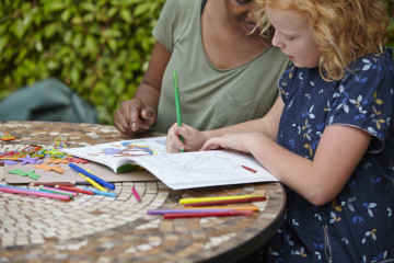 Mum and girl colouring