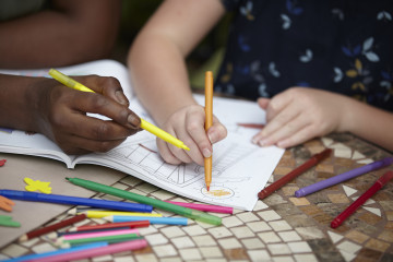 Mum and girl colouring