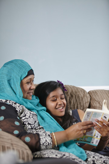 mum and girl reading together