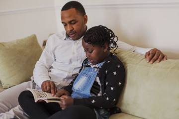 Dad and daughter reading