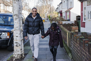 Dad and daughter walking