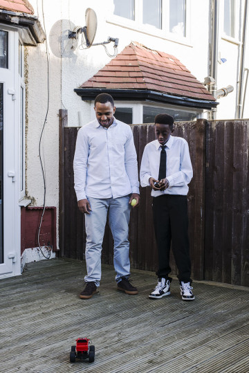 Dad and son playing with remote control car