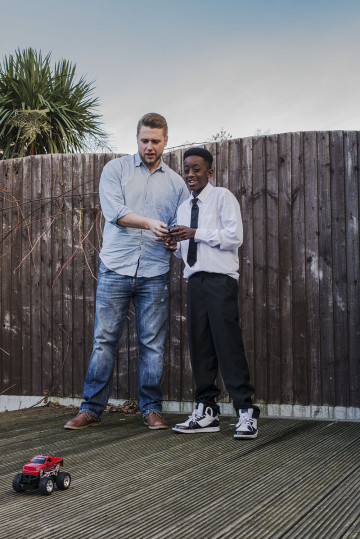 Dad and son playing with remote control car