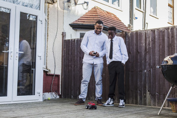 Dad and son playing with remote control car