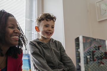 Mother with son playing game