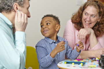 Dad and Mum with son crafting