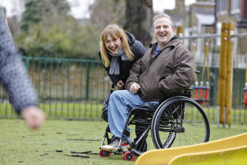 Dad and mum with daughter in park