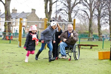 Dad and mum with daughters in park