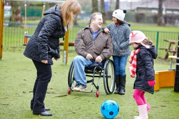 Dad and mum with daughters in park