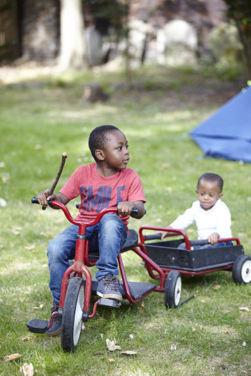 Siblings playing on go cart