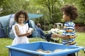 Brother and sister sandpit fun