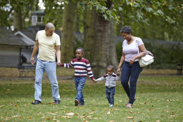 Family strolling in park