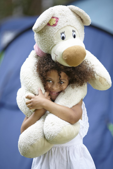 Girl having a cuddle with bear