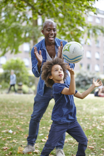 Dad and son playing ball