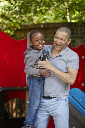 Dad and son enjoy slide