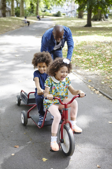 Father, son and daughter on bike