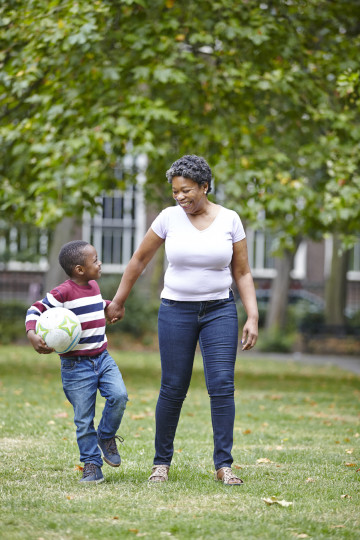 Mum and son with football