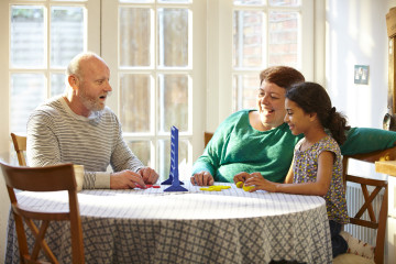 Dad, mum and daughter play game