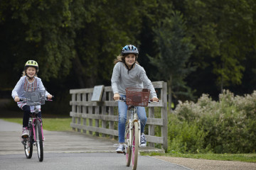 Siblings racing on bikes