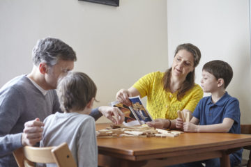 Family playing together at table