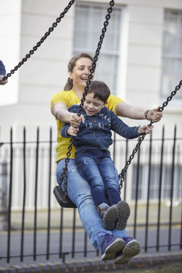 Family on swings together