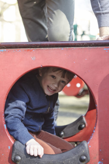 Boy laughing towards camera