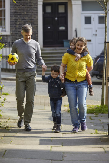 Parents take children for walk