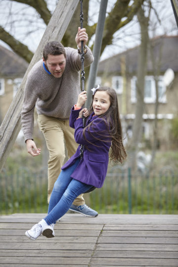 Dad and daughter on the zip wire