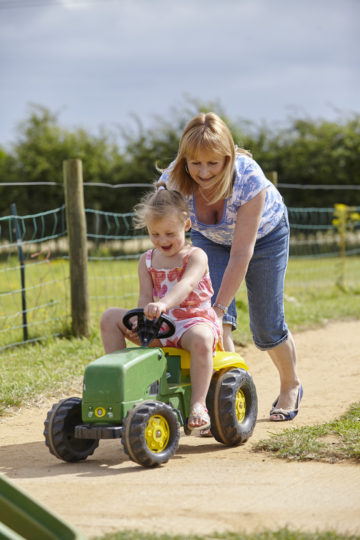 Playing on tractor