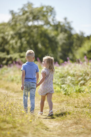 siblings in field together