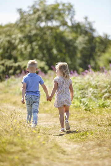 Brother and sister walking