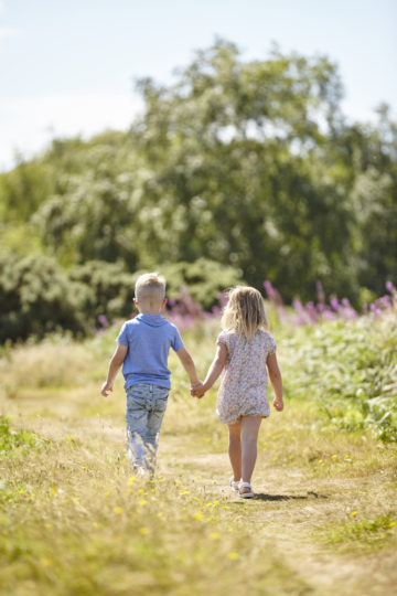 siblings walking together