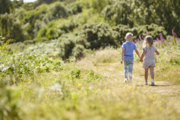 Brother and sister walking together