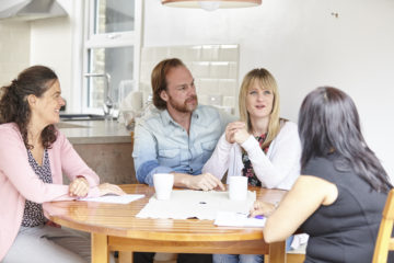 Social worker at table