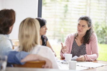 Social worker at table