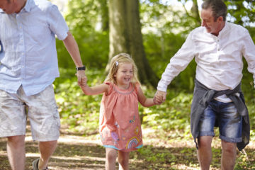 Family walking in woods