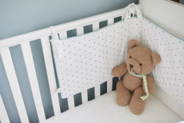 Teddy in the cot