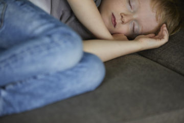 Sleeping boy on the couch