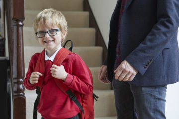 Putting on school bag