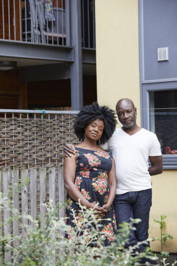 Couple outside their house