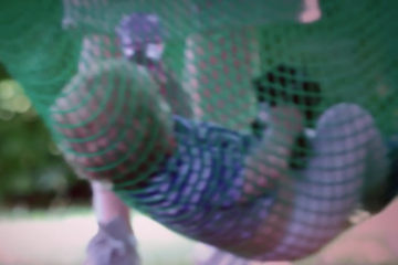 Boy in a hammock at an Adoption Activity Day