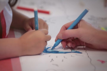 Children colouring in at Adoption Activity Day